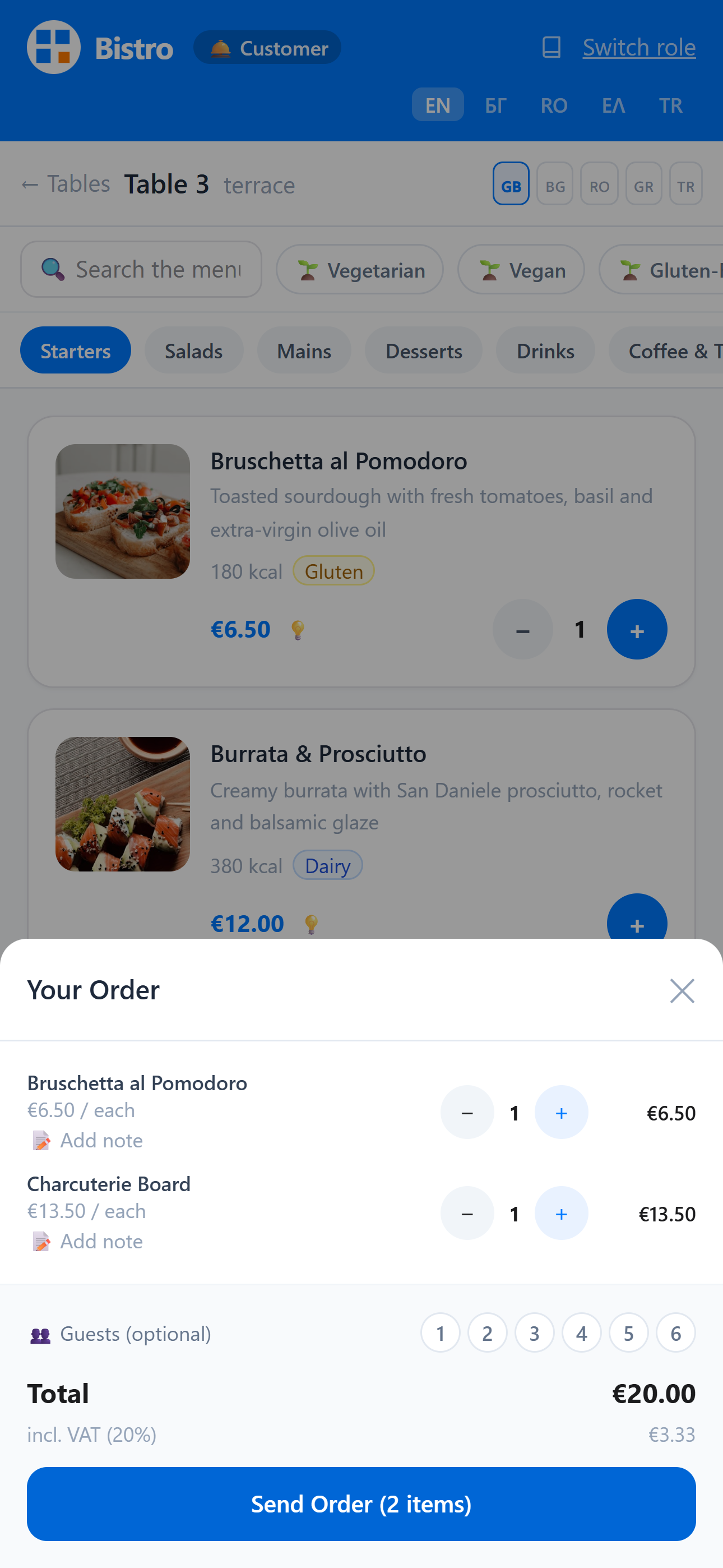 FlashOrder on a guest's phone after scanning a table QR code: the order sheet over the menu, with two items, the total including VAT and a Send Order button